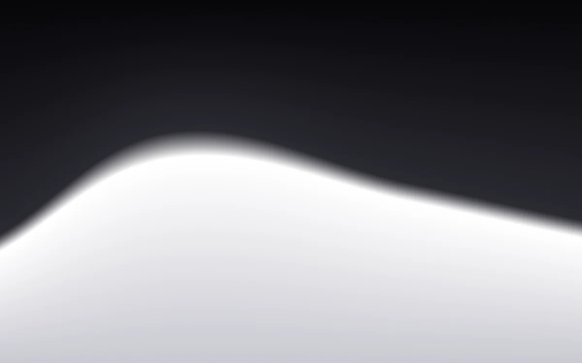 Eclipse: Black above, a white edge of light below.